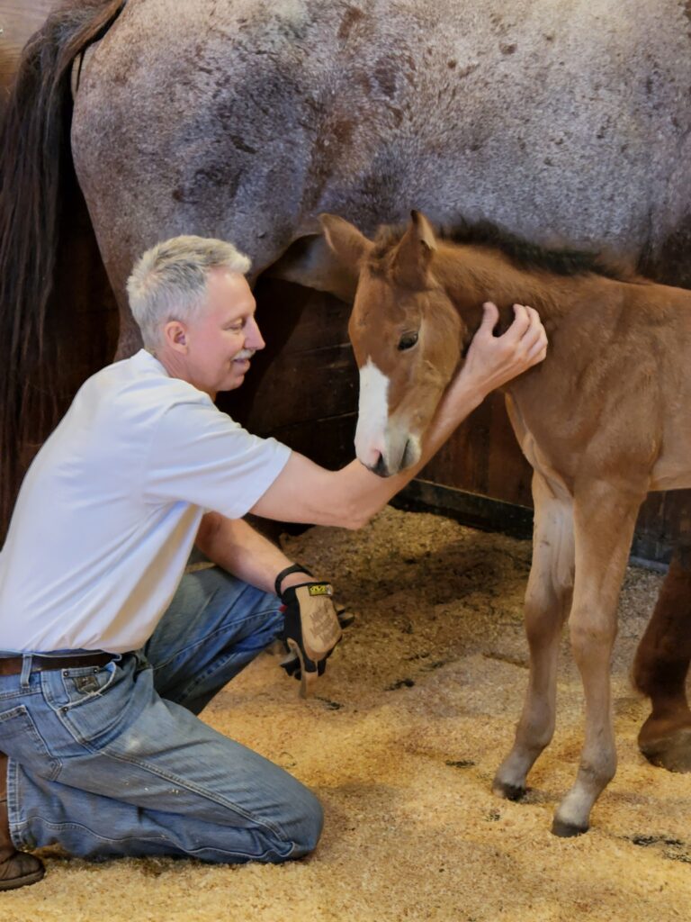 A Man Kneeling Down on the Ground.