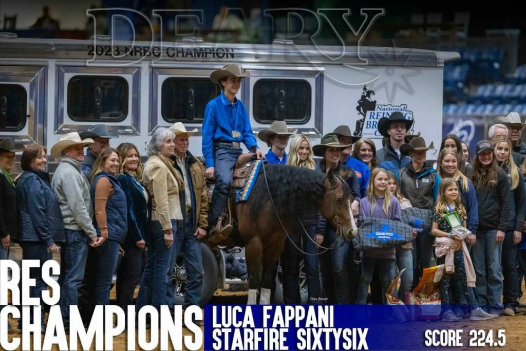 A Group of Riders and Horses Standing Together, Posing for a Photo With a Picturesque Backdrop.