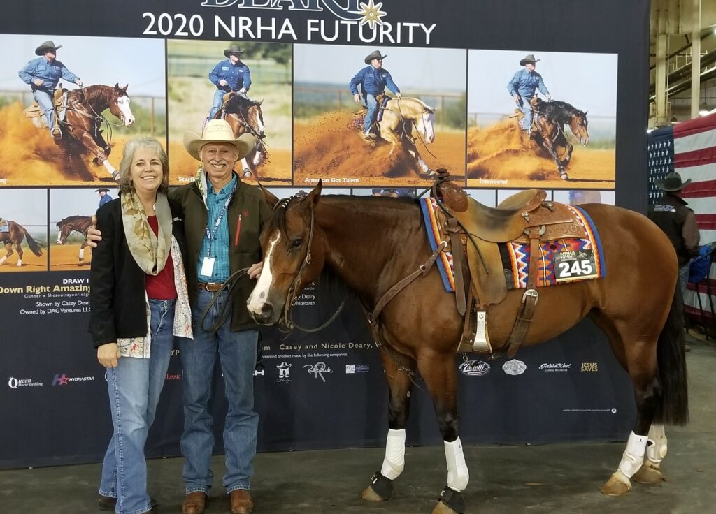 Two Individuals Standing Beside a Horse With a Banner Displaying “2020 Nhra Authority.”
